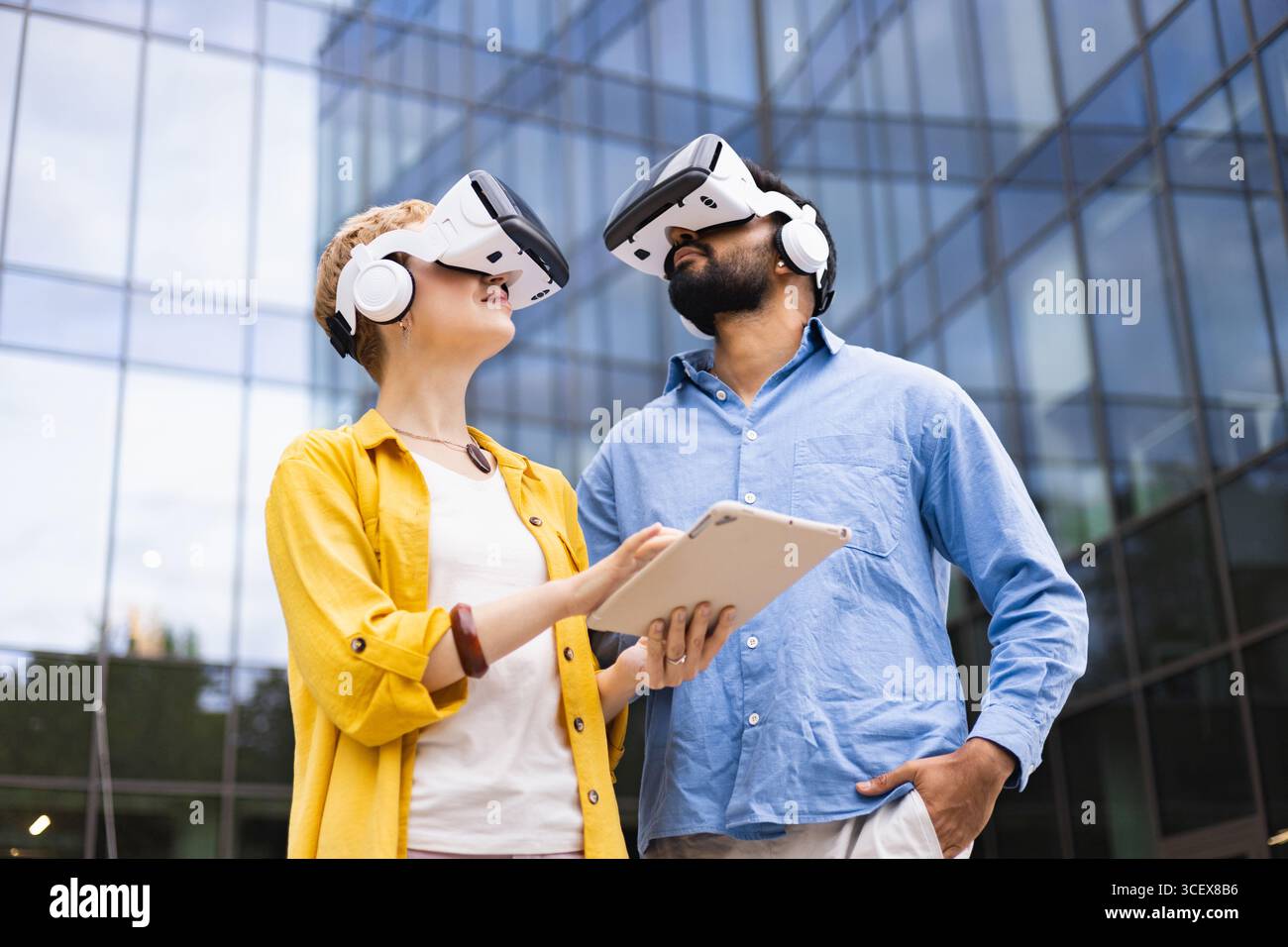 Exploring VR Technology Together Stock Photo