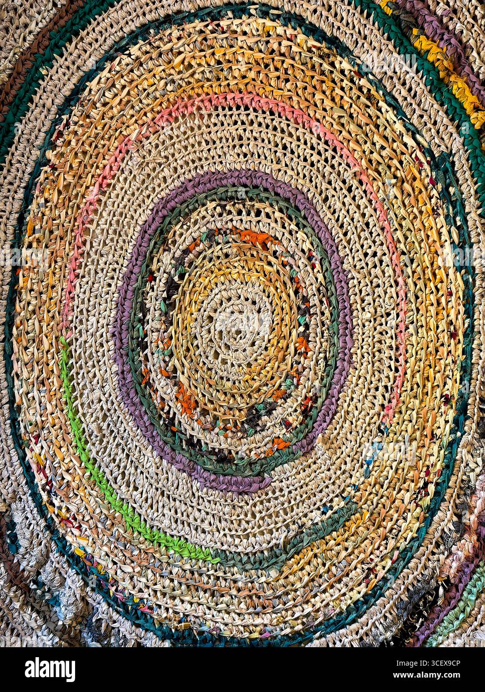 Colorful traditional hand-knitted rug with concentric patterns Stock Photo
