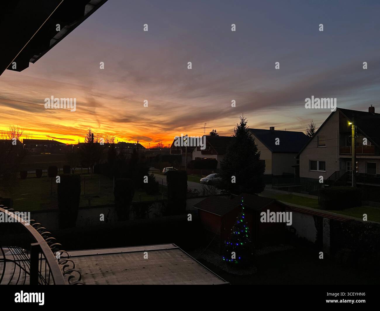 winter, Christmas holidays, New Year's sunset over the small city, Christmas in Hungary - Smartphone Captured Stock Image