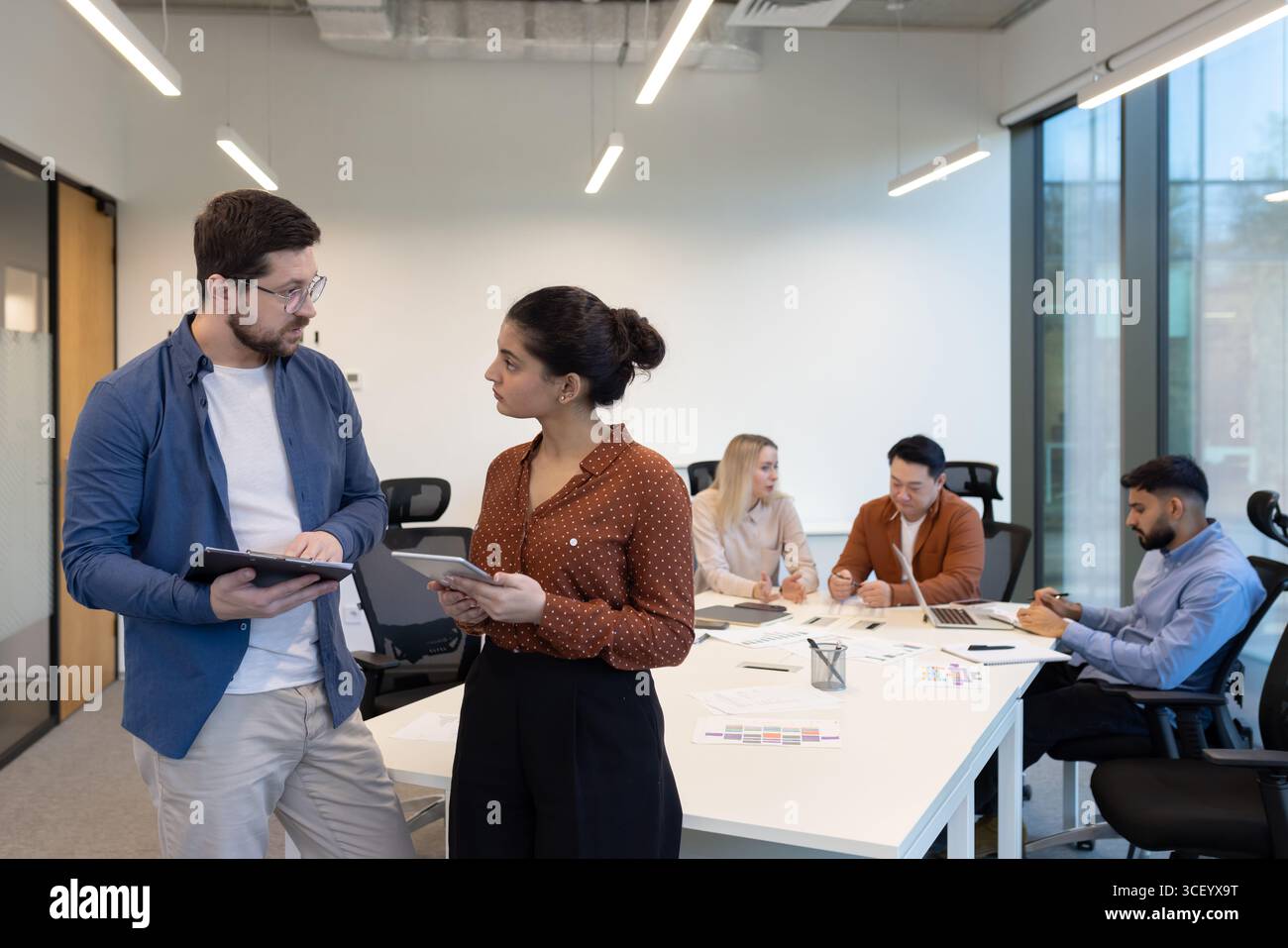 Dynamic creative meeting team members hi-res stock photography and ...