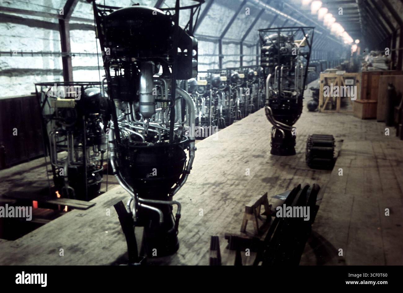 This photo shows V-2 rocket engines at the Mittelwerke underground ...