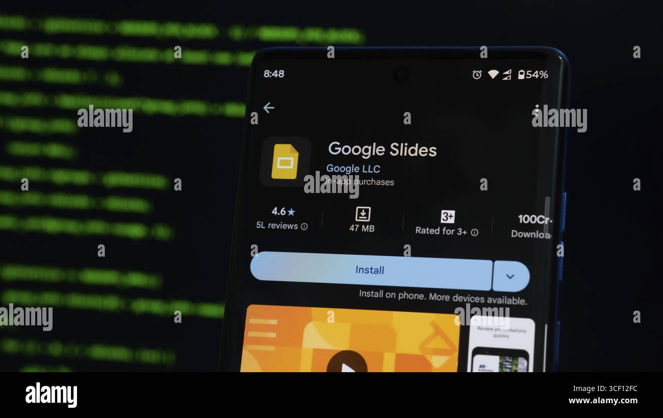 Google Slides app screen on a smartphone with green code in the ...