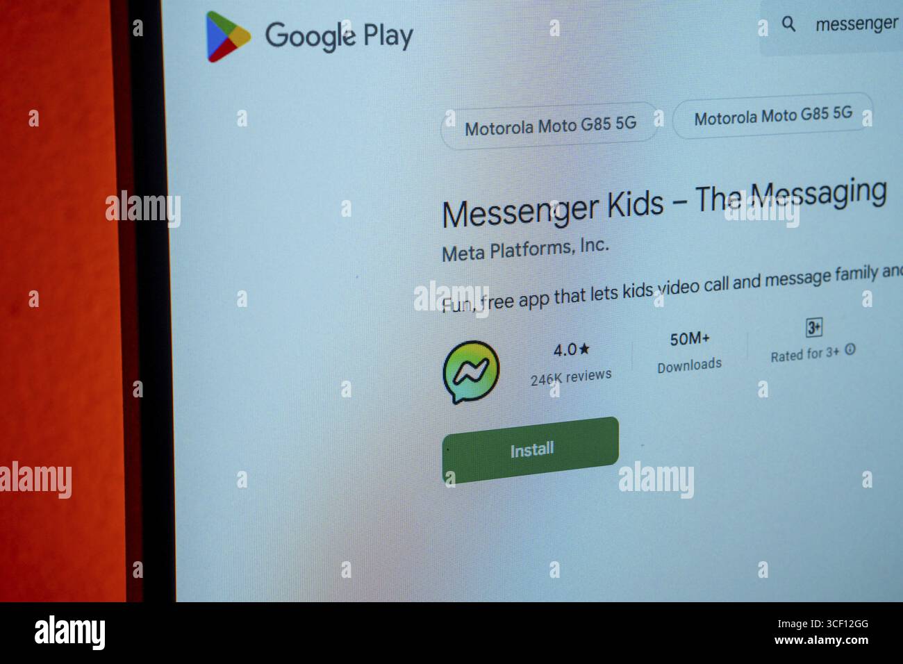 Desktop screen showing Messenger Kids app listing on Google Play, ready for installation Stock Photo
