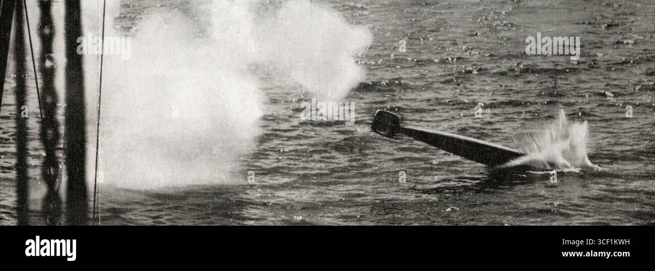 A British torpedo plunges into the water at an angle after being fired ...