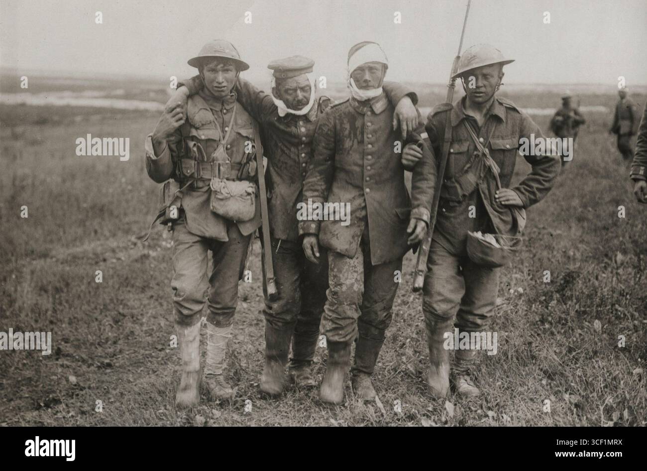 British soldiers assist wounded German prisoners of war during World ...