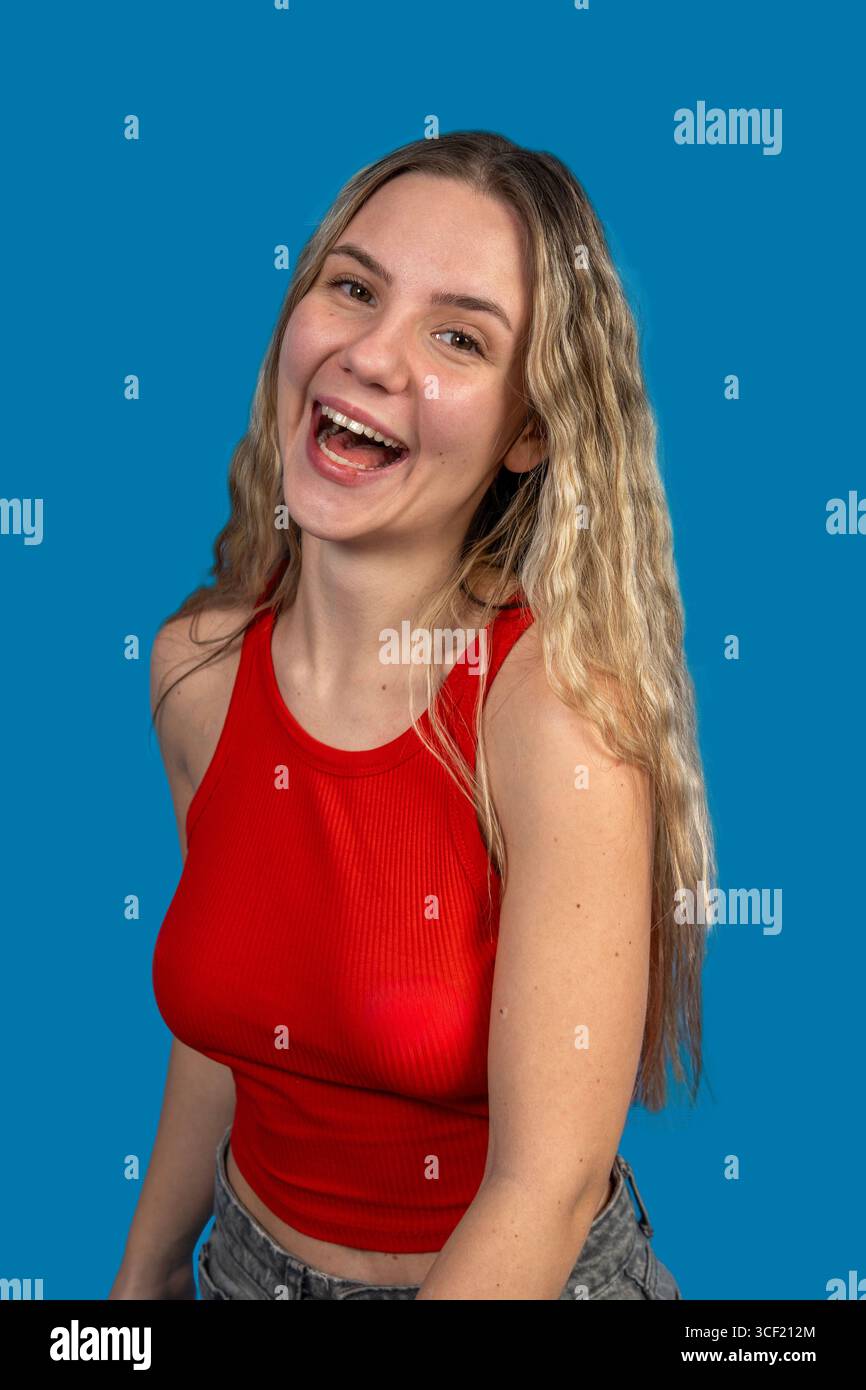 Wearing red top and blue jeans hi-res stock photography and images - Alamy