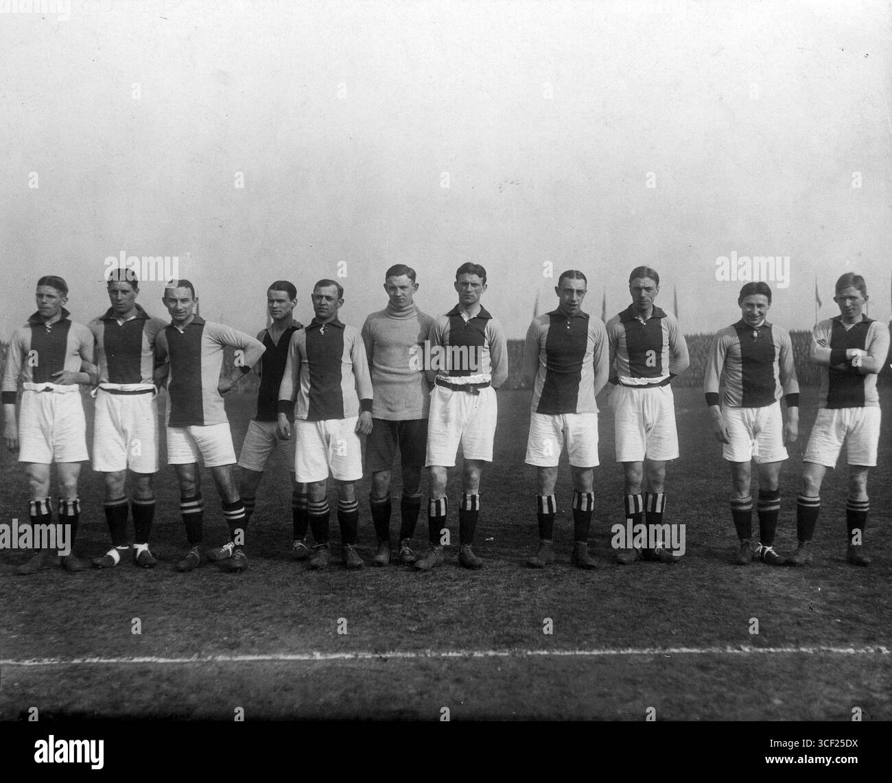 The Ajax football team of 1918 is depicted, with Jan de Natris positioned far left. The photo includes players Henk Hordijk and Fons Pelser. Stock Photo