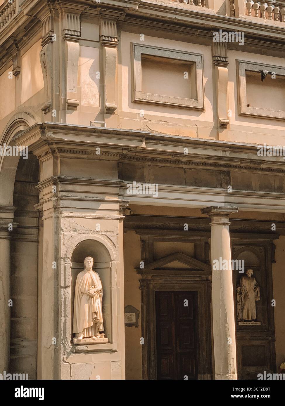 Atmospheric buildings in the streets of Florence, Italy with Sculptures - Smartphone Captured Stock Image