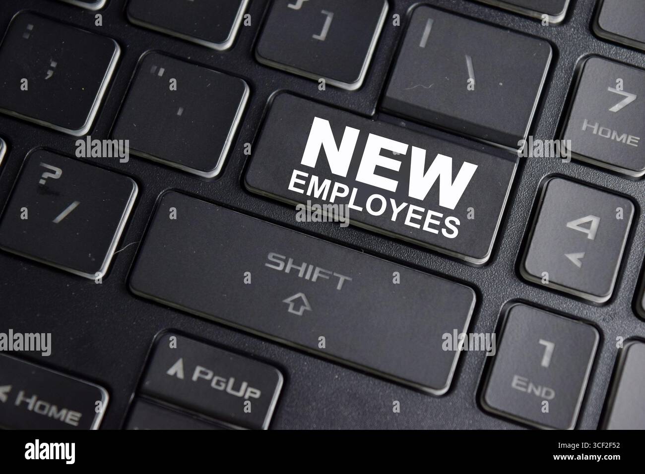 New employees on the button keyboard Stock Photo