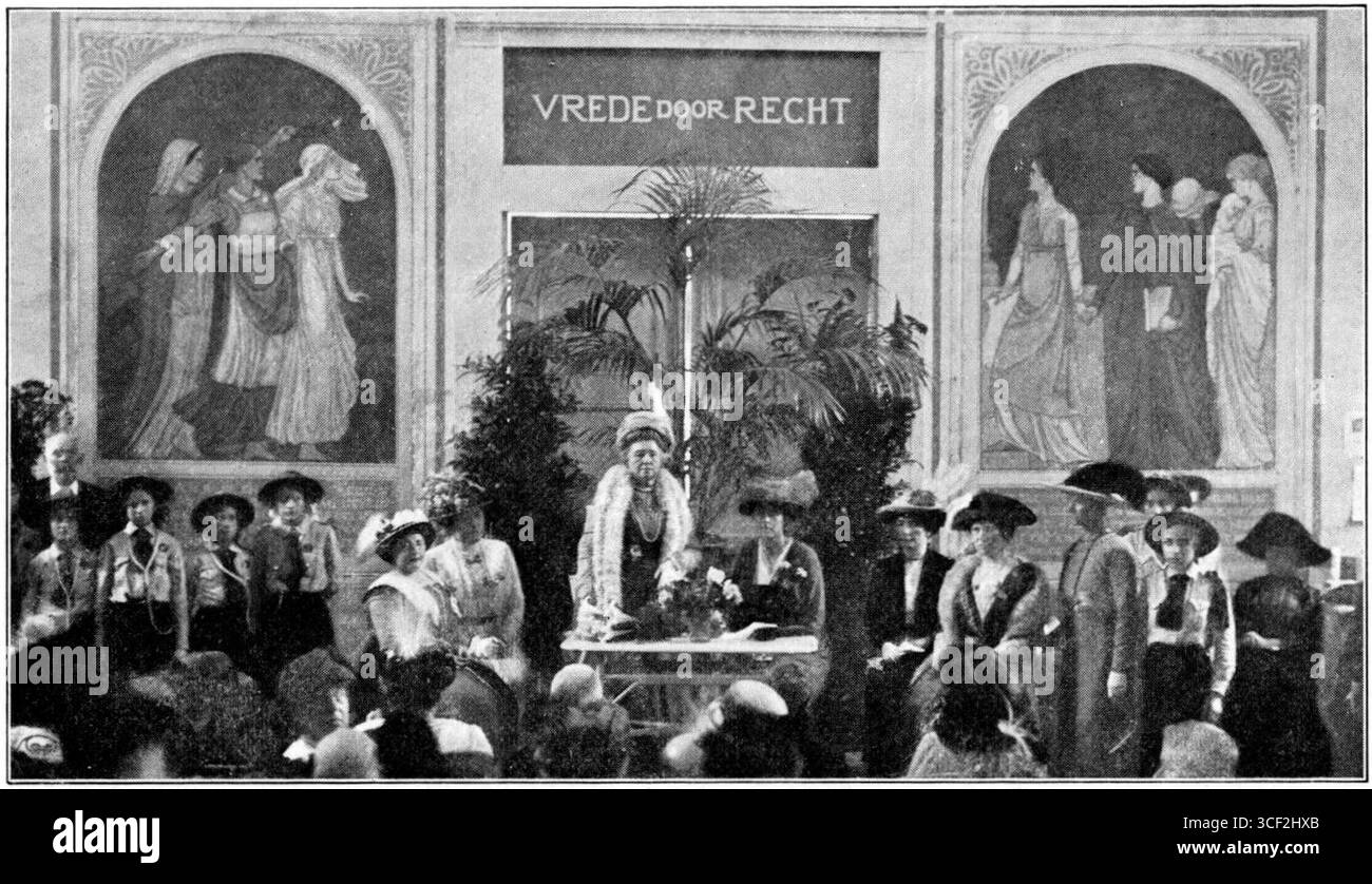 Bertha von Suttner delivering a lecture on Peace and the Women's Movement in 1913. The photograph also features Rosa Manus, Baronesse Sloet van Hagensdorp, Dr. Mia Boissevain, Freule Backer, L. C. A. van Eeghen, and B. Midderigh-Bokhorst. Stock Photo