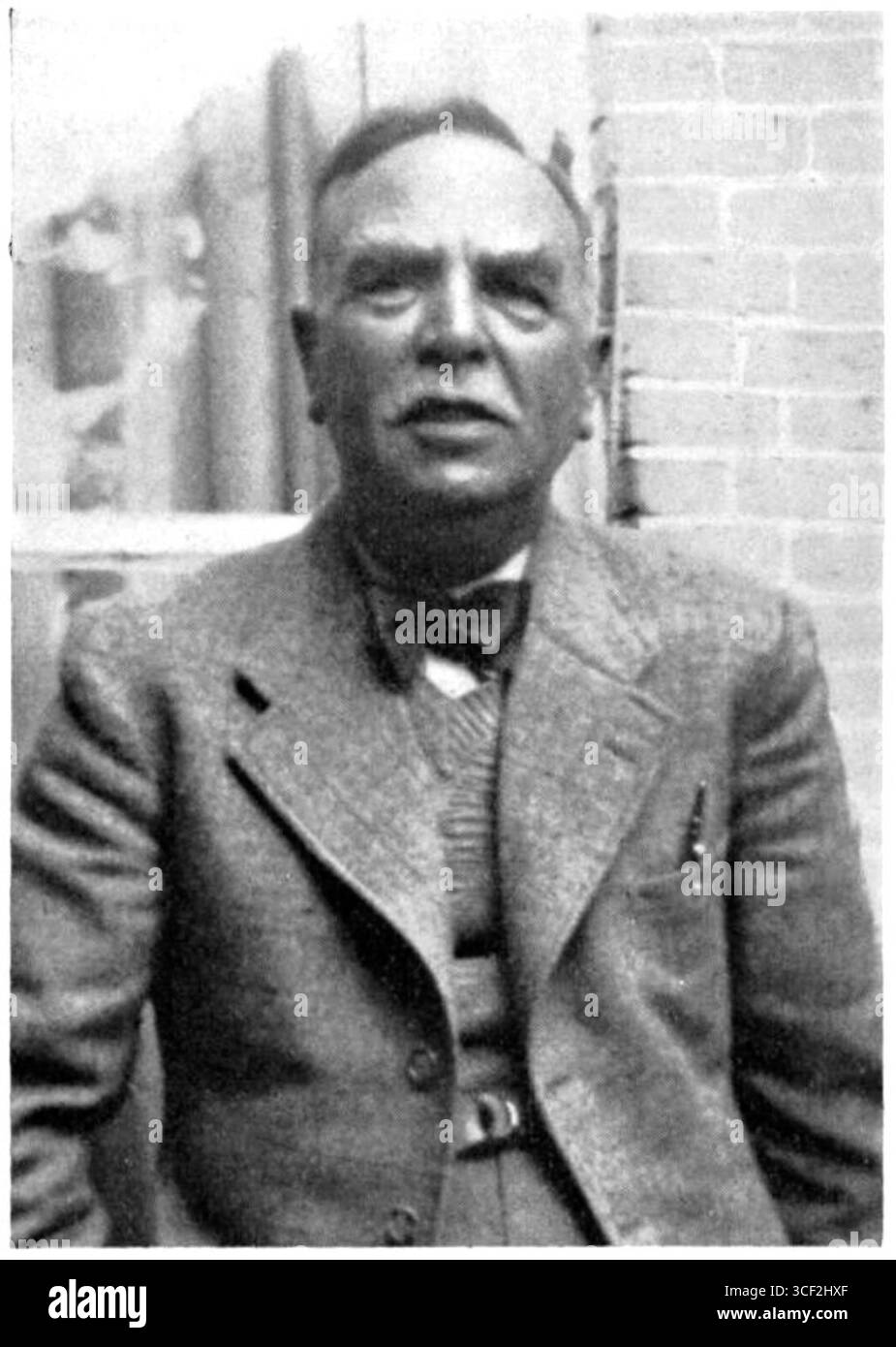 This 1938 photograph is of Cornelis van der Sluys, a notable figure from the late 1930s. It captures his likeness during this period. Stock Photo
