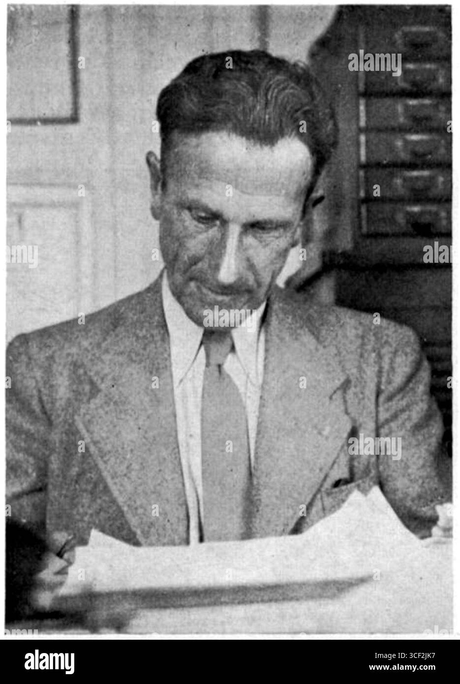 A portrait of Han van Loghem, a Dutch individual, taken in 1938. The identity and context of the photograph remain unclear. Stock Photo