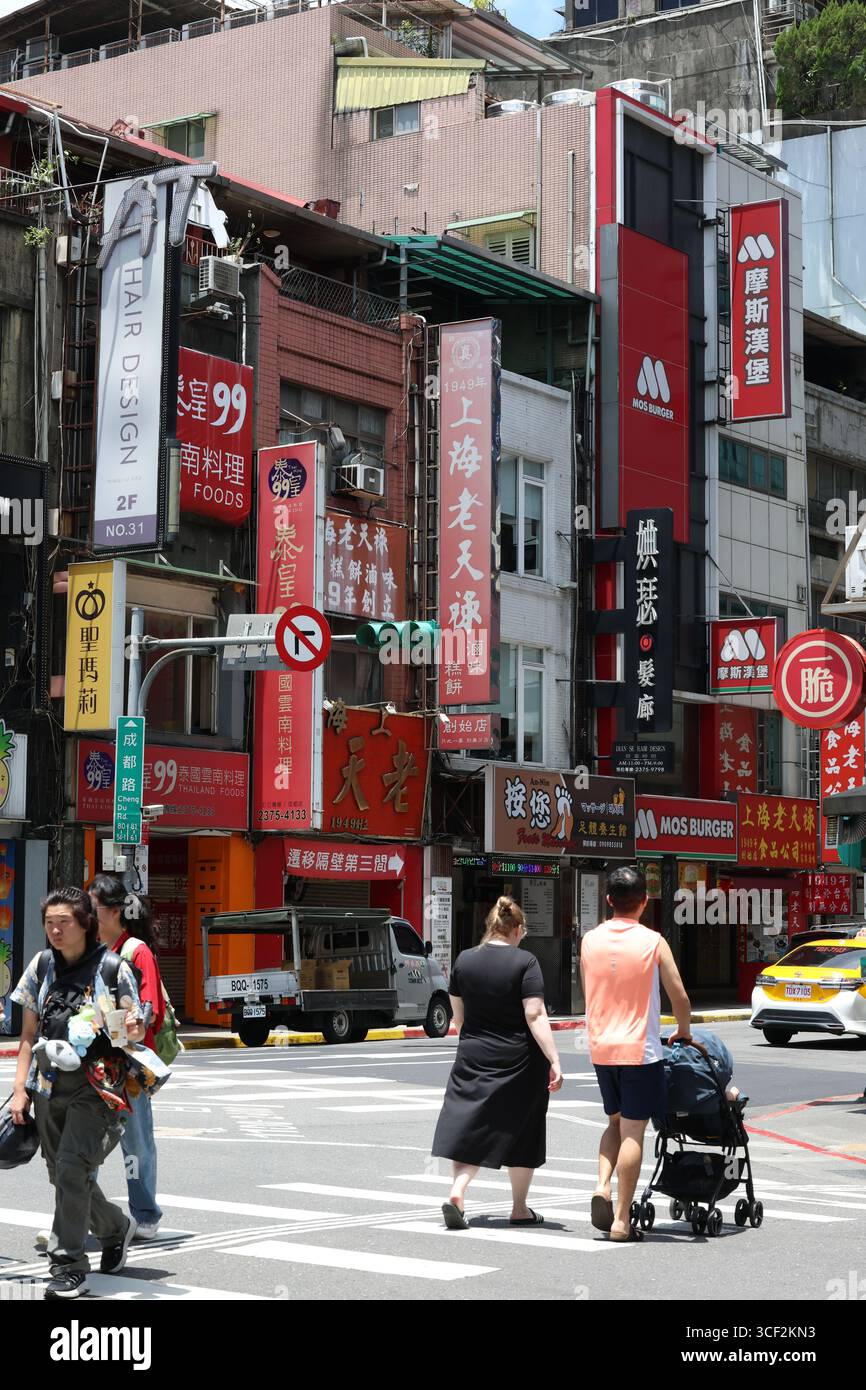 TAIPEI, TAIWAN. 2 JUNE, 2025. Pedestrians cross a busy intersection in ...