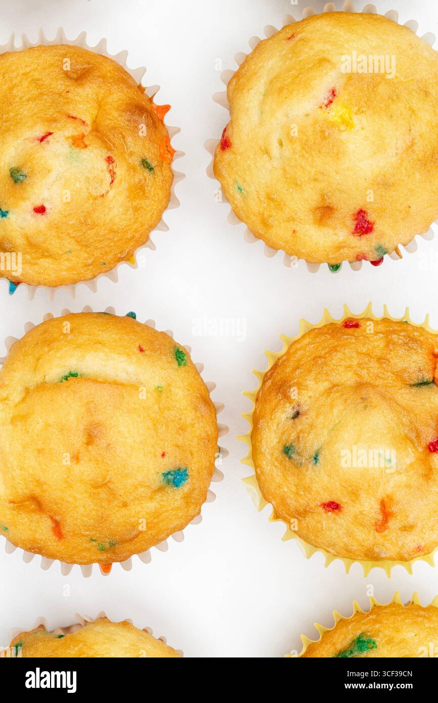 Confetti Vanilla Cupcakes on a White Background Stock Photo