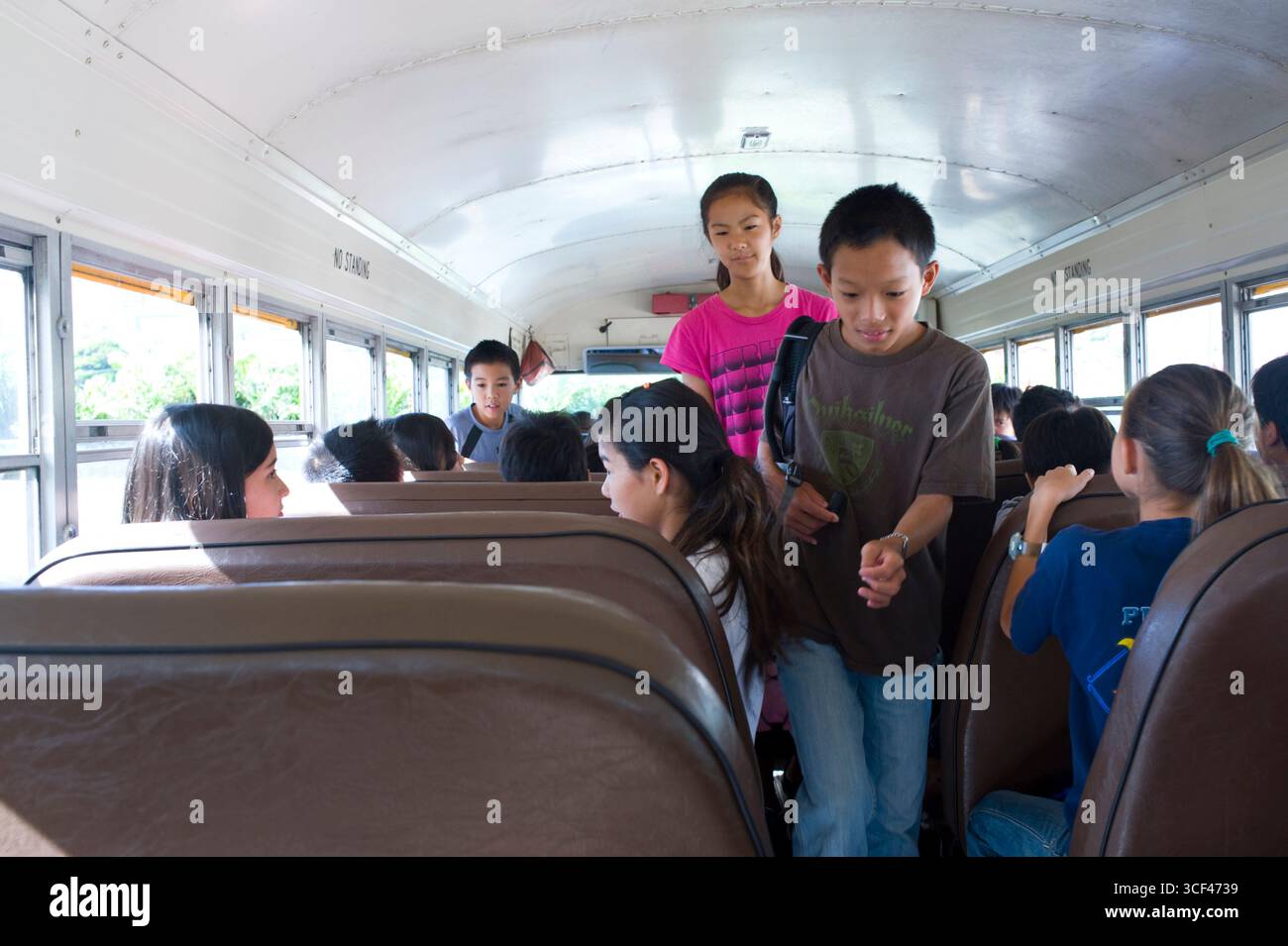 6th grade school children inside school bus, Honolulu, Oahu, Hawaii ...