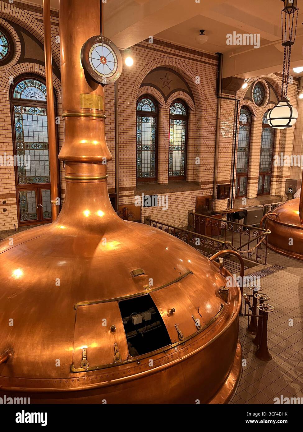 Copper brewing vats inside the historic Heineken Experience museum in Amsterdam, Netherlands. - Smartphone Captured Stock Image