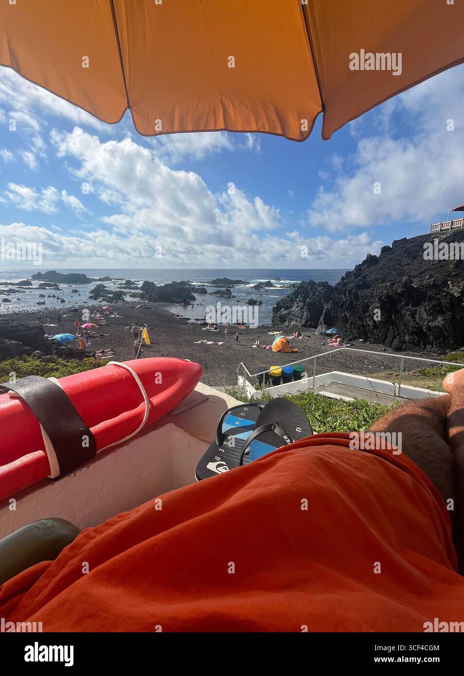 Lifeguard outpost overlooking a volcanic natural pool and black sandy rock beach in Mosteiros, São Miguel, Azores, Portugal. - Smartphone Captured Stock Image