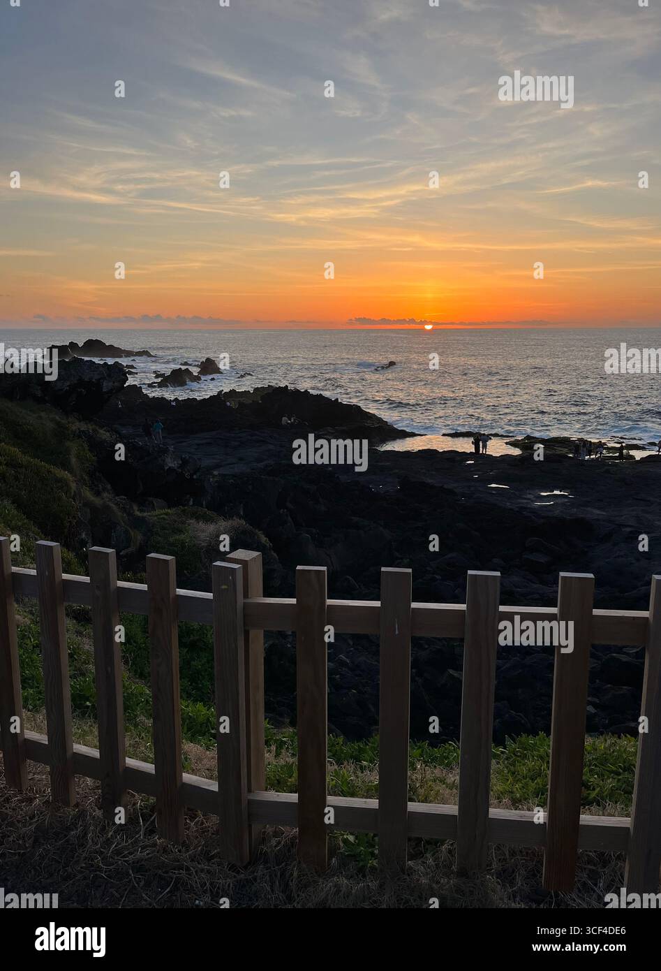 Sunset over the volcanic natural pools in Mosteiros village, São Miguel, Azores, Portugal. - Smartphone Captured Stock Image