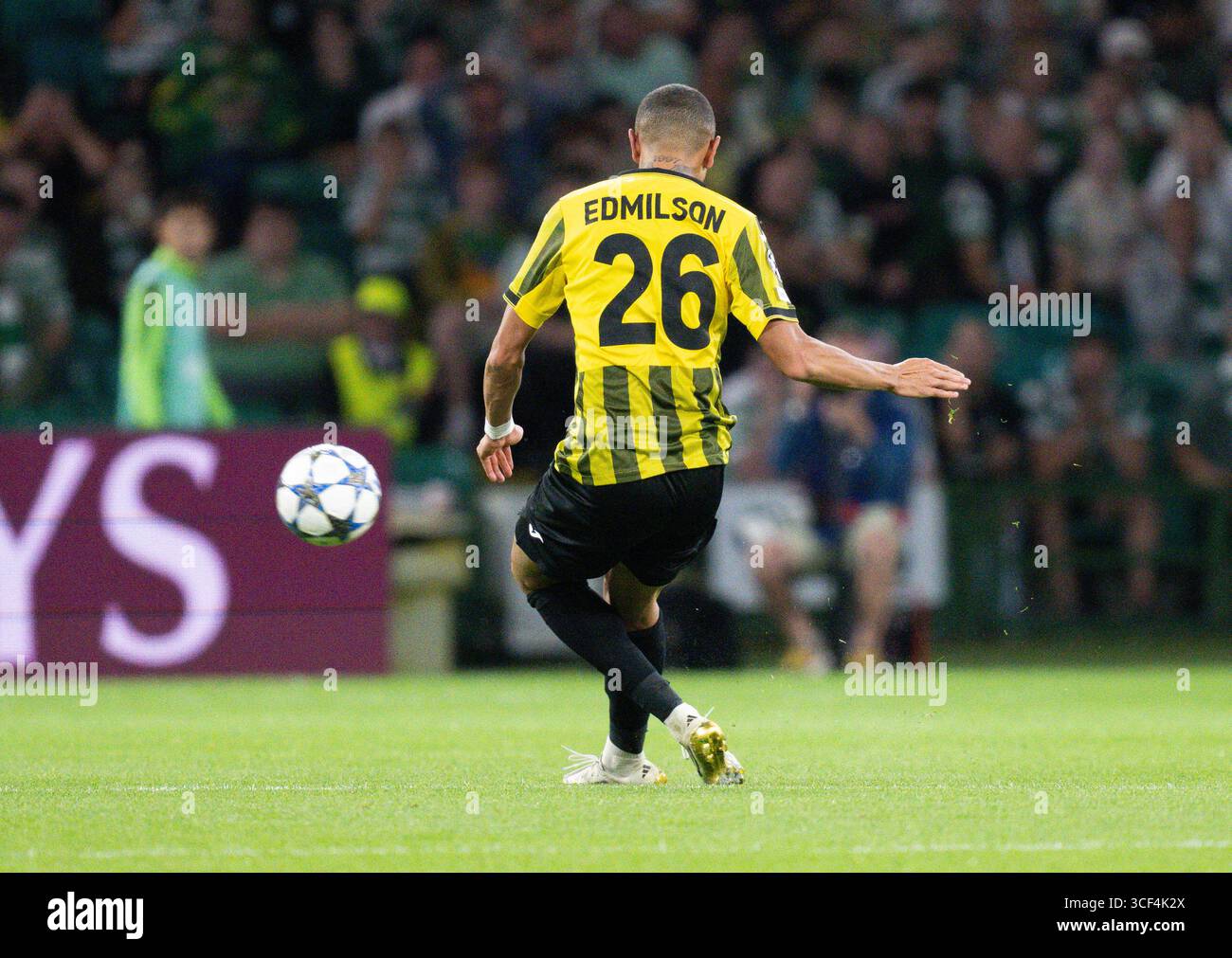 GLASGOW, SCOTLAND - AUGUST 20: Kairats' Edmilson has a shot which almost lobs the keeper during a Uefa Champions League Play-Off 1st leg match between Celtic and Kairat Almaty at the Celtic GLASGOW, SCOTLAND - AUGUST 20: Kairats' Edmilson has a shot which almost lobs the keeper during a Uefa Champions League Play-Off 1st leg match between Celtic and Kairat Almaty at the Celtic
