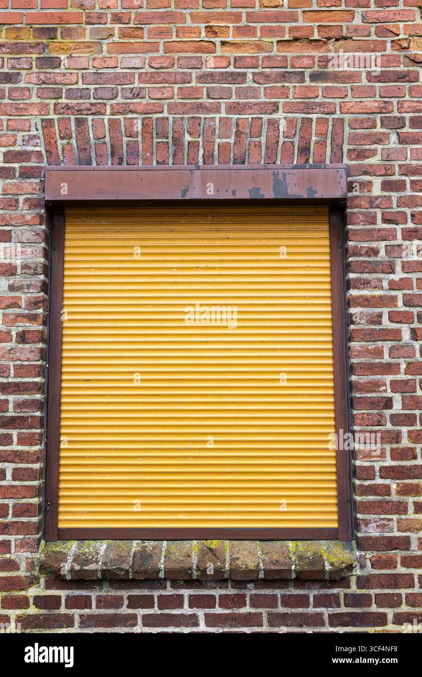 Window with closed roller shutter Stock Photo