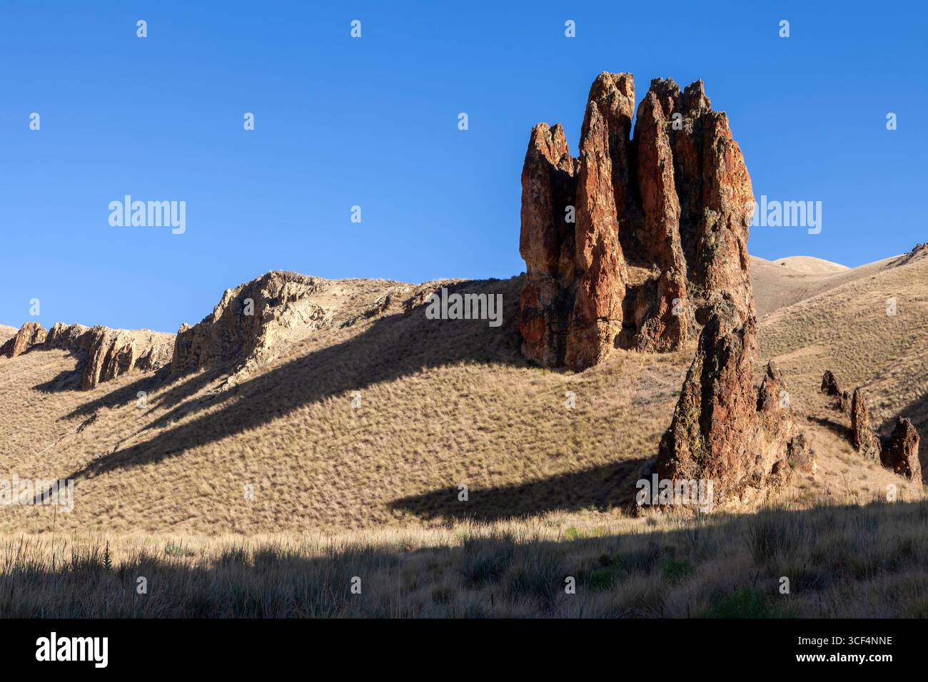A basalt spire rises from the caldera floor at the Leslie Gulch Area of Critical Environmental Concern in Oregon's Owhyee Mountains. Leslie Gulch lies Stock Photo