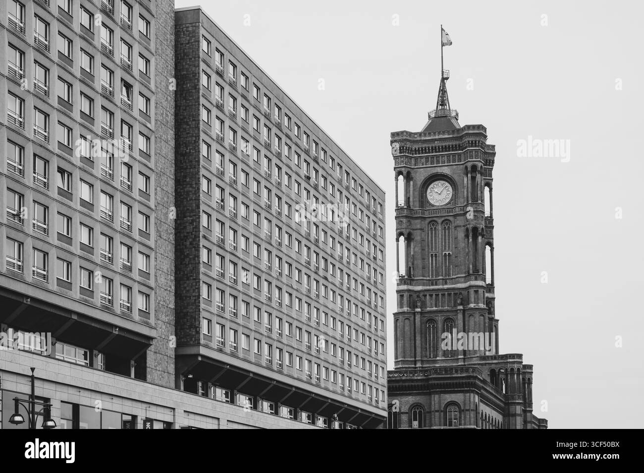 Germany, Berlin, Mitte, Red City Hall next to prefabricated building, black and white Stock Photo
