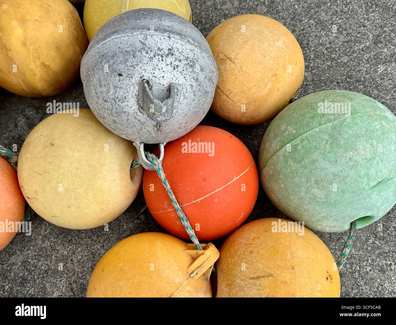 Colorful pile of buoys on land in Husavik. - Smartphone Captured Stock Image