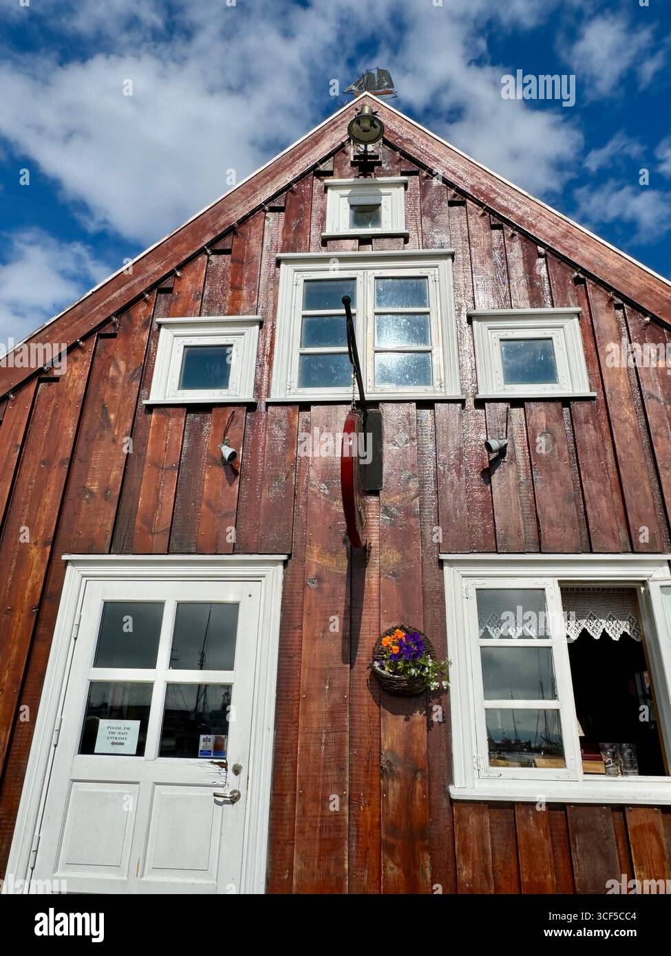 Beautiful wood details of an iconic restaurant at the Husavik harbor. - Smartphone Captured Stock Image
