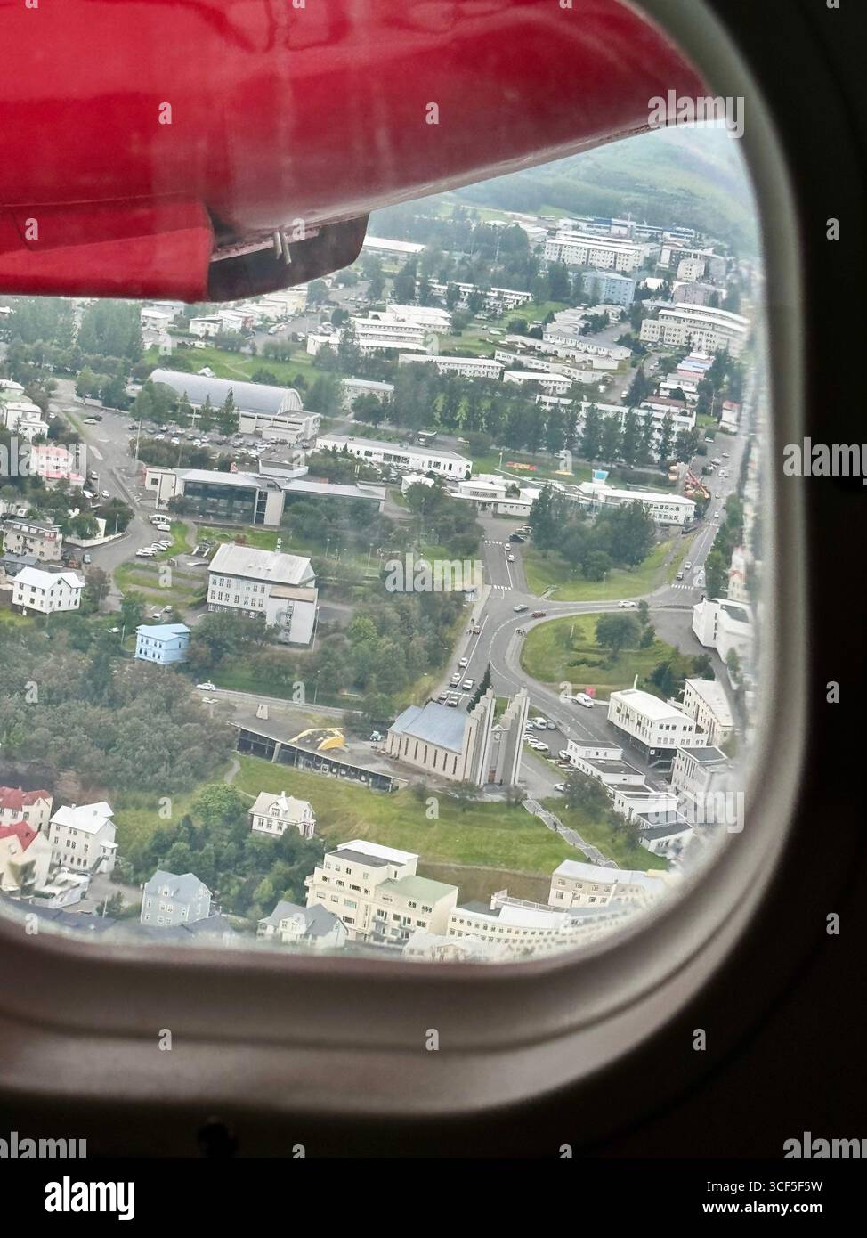 Small plane window view over Akureyri, Iceland - Smartphone Captured Stock Image