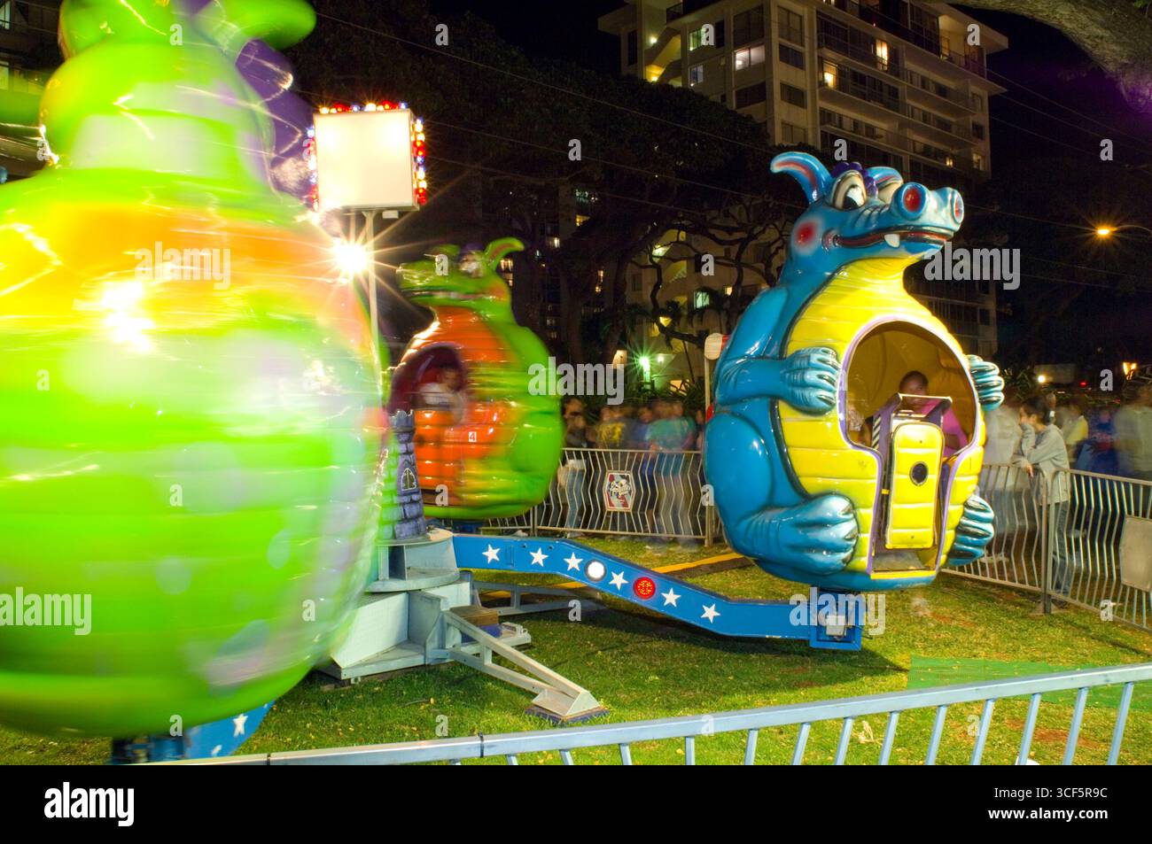 Amusement ride for younger children at the Punahou School Carnival, Honolulu, Oahu, Hawaii, USA. The 2006 Punahou Carnival is sponsored by the School' Stock Photo