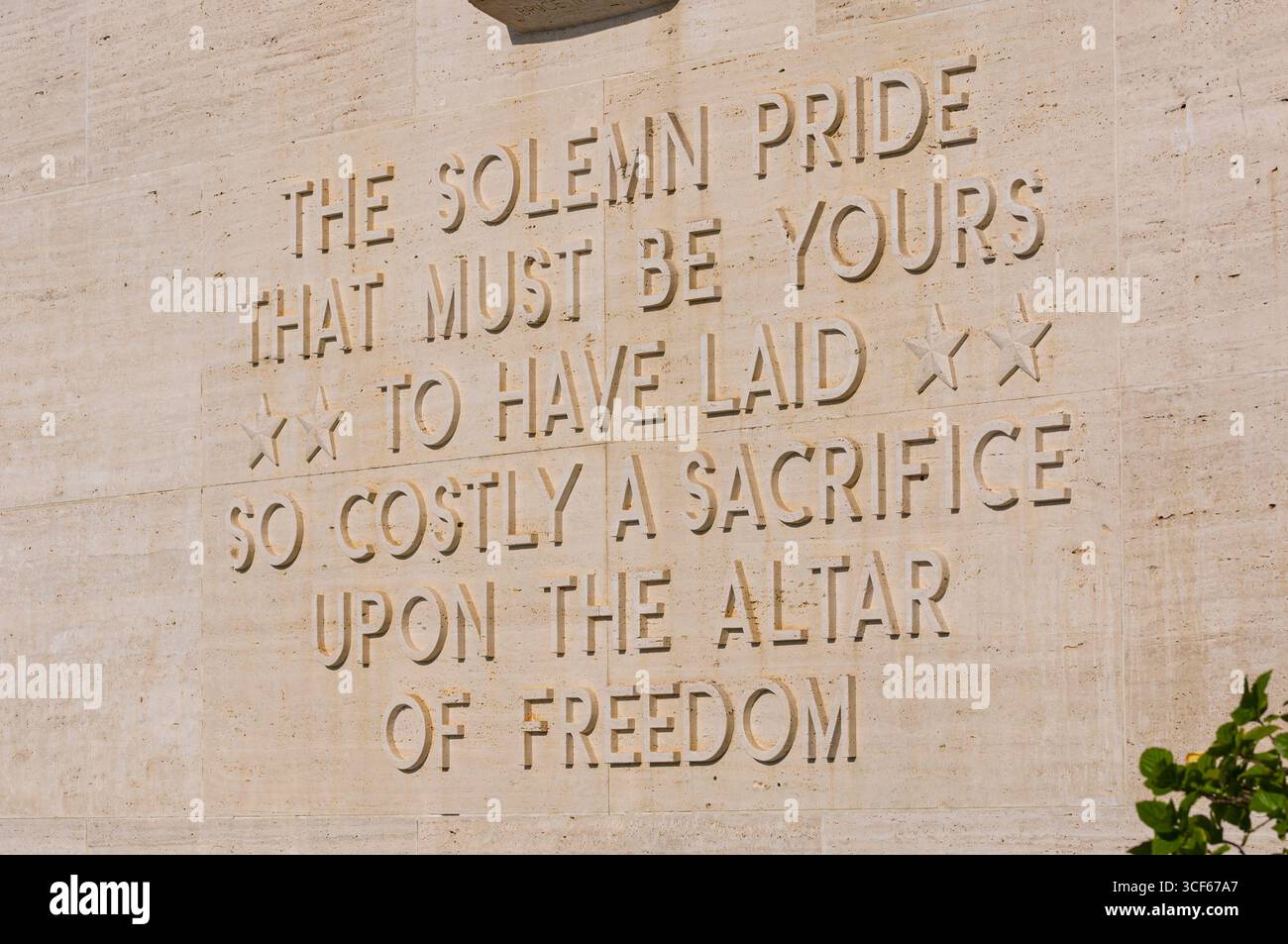 Raised letters in stone that read “What Solemn Pride That Must Be Yours ...