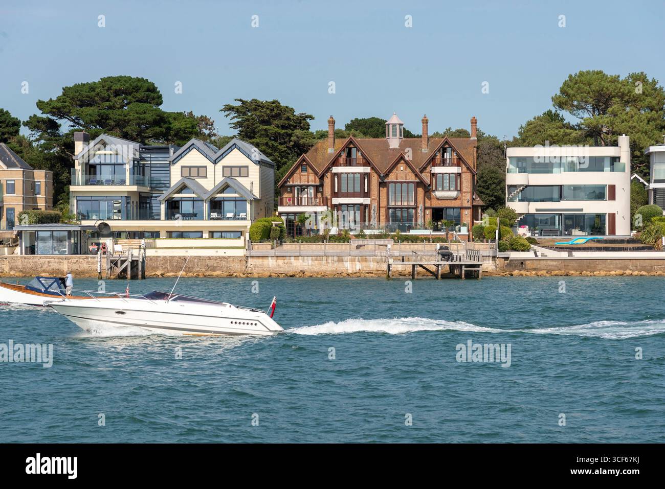 Sandbanks Poole Dorset England UK. 17.08.2025. Exculsive homes facing Poole Harbour on Sandbanks peninsula UK Stock Photo
