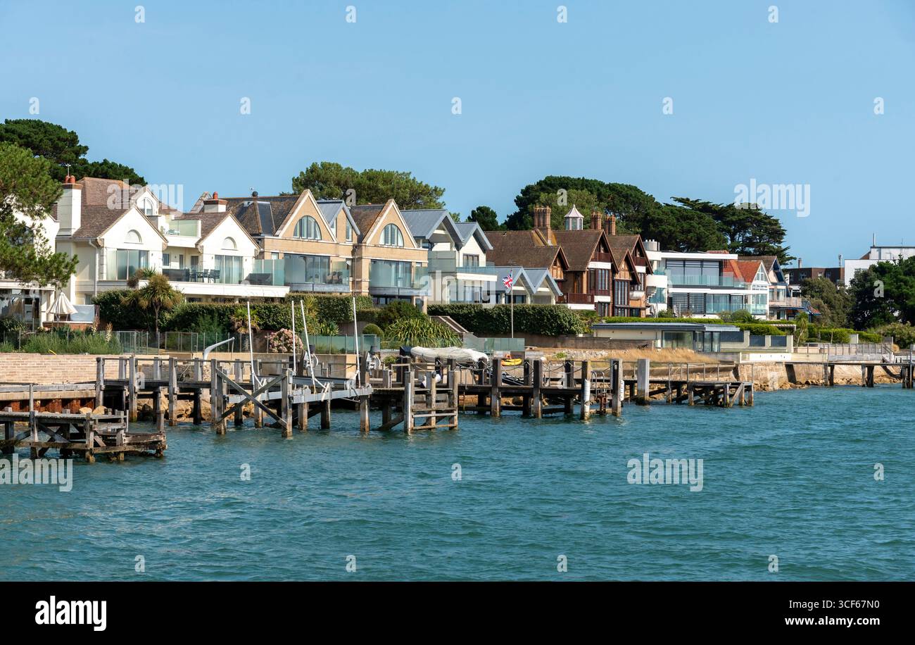 Sandbanks Poole Dorset England UK. 17.08.2025. Exculsive homes facing Poole Harbour on Sandbanks peninsula UK Stock Photo