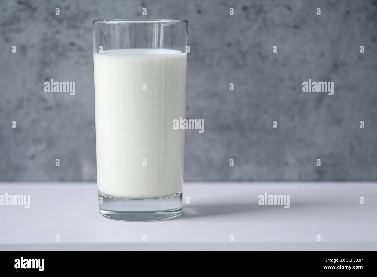Close-up of glass with milk on table Stock Photo