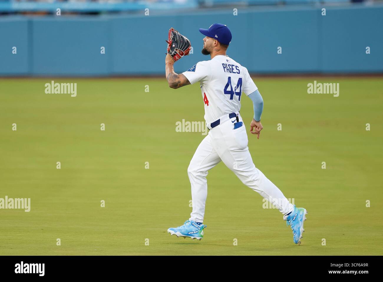 Andy Pages #44 of the Los Angeles Dodgers catches a fly out during a ...