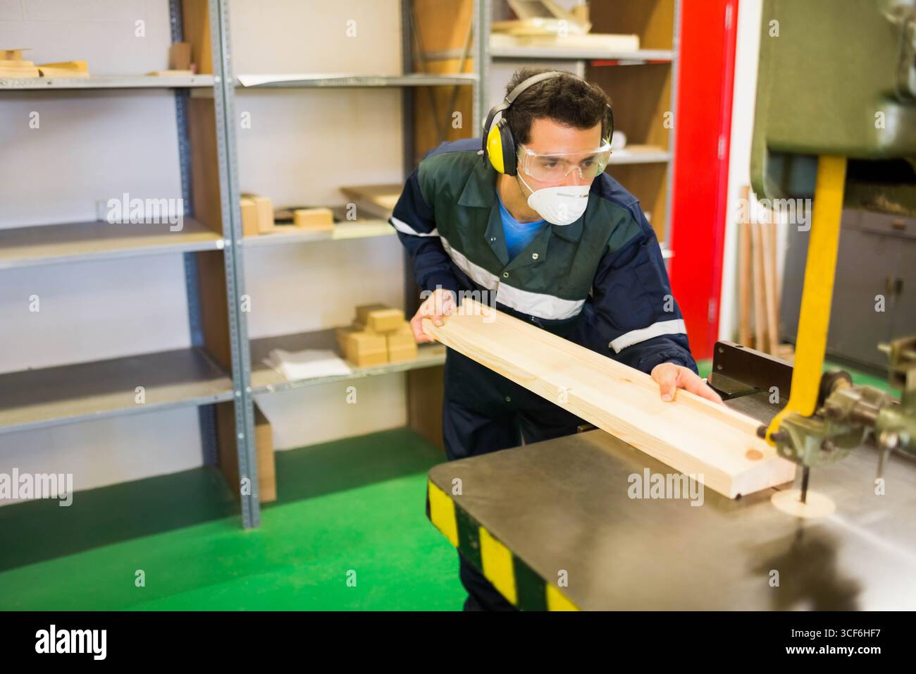 Focused male woodworker wearing safety hi-res stock photography and ...