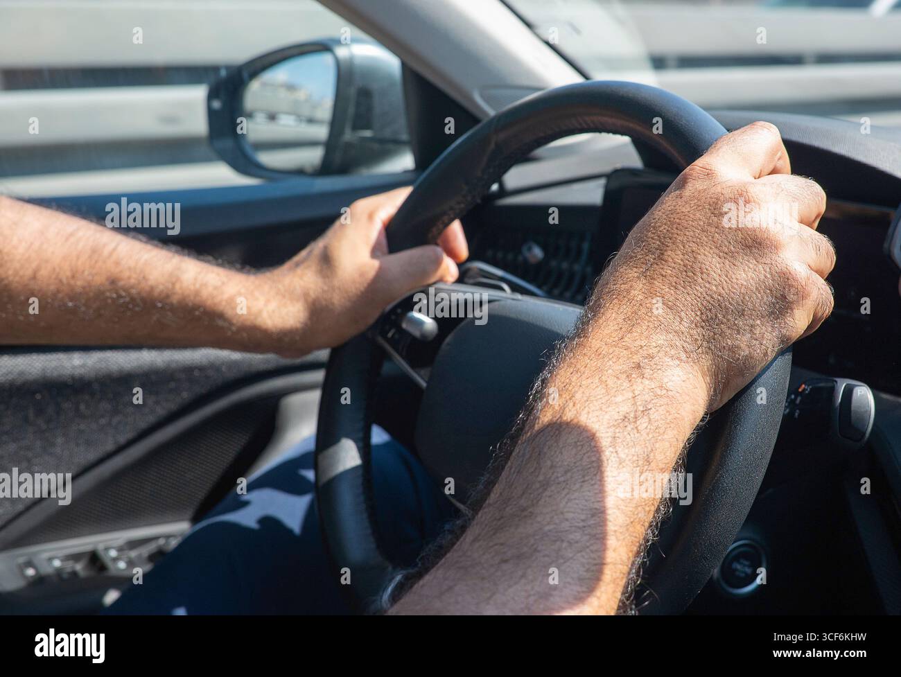 Mens hands on wheel hi-res stock photography and images - Alamy