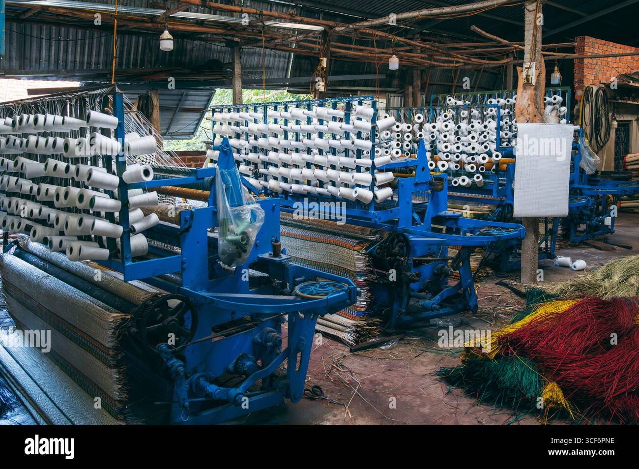 workshop with weaving machines for production of woven reed mats in ...