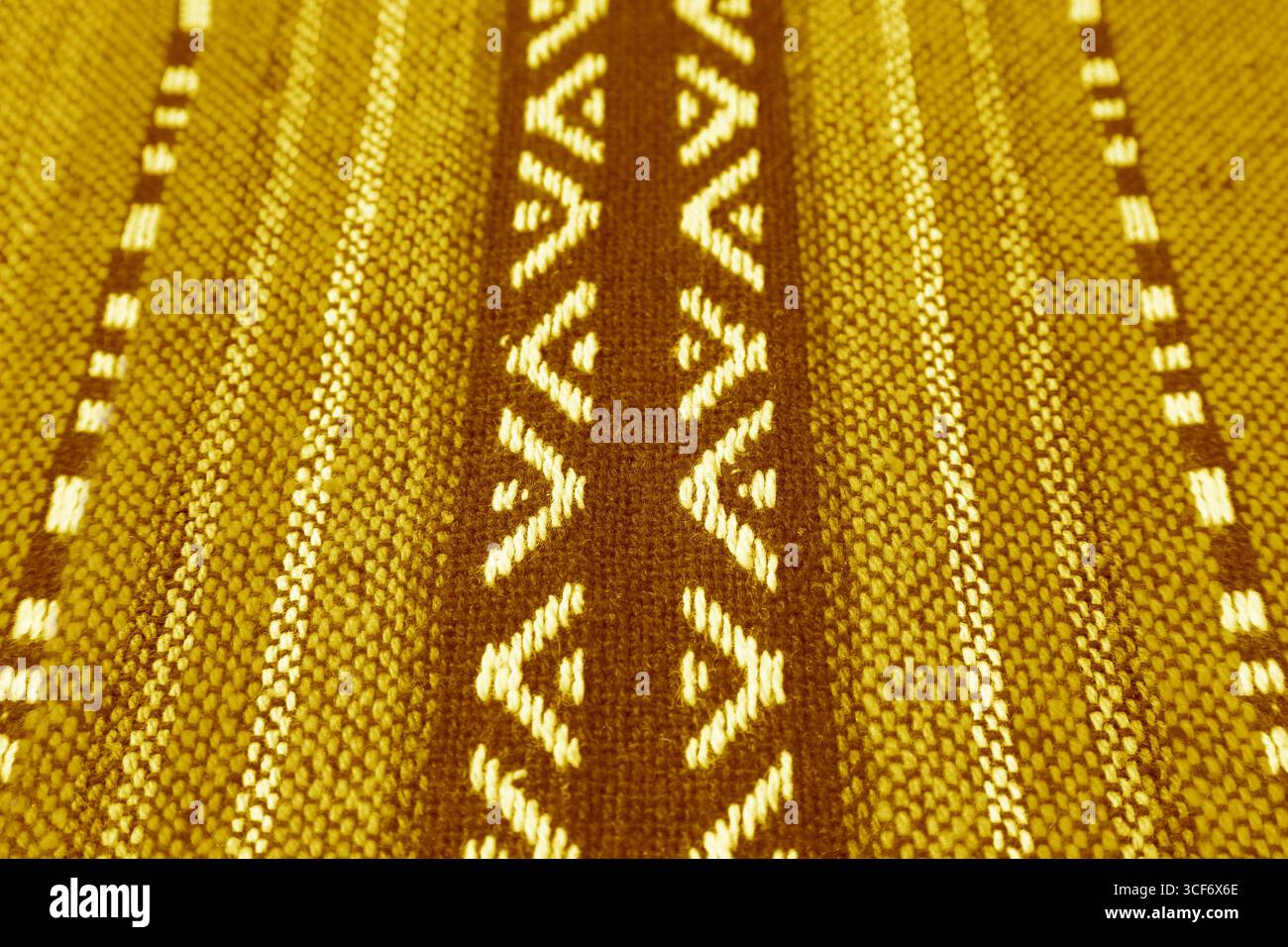 Closeup of Texture and Pattern of Classy Yellow and Brown Thai Northern Region's Traditional Textile Stock Photo
