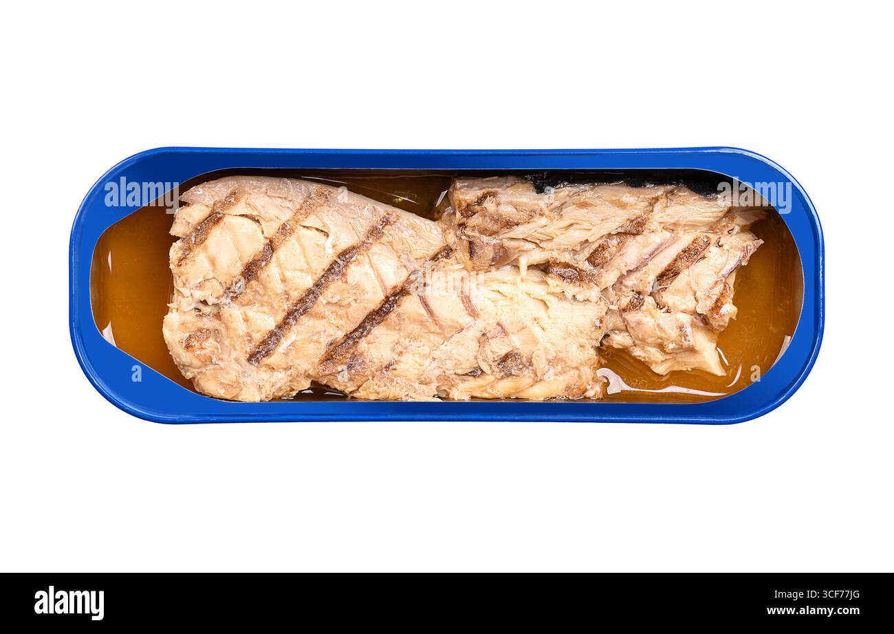 Grilled mackerel fillet, in its own juice, in an opened tin can. Salted piece of mackerel, fried on a grill, preserved in liquid. Stock Photo
