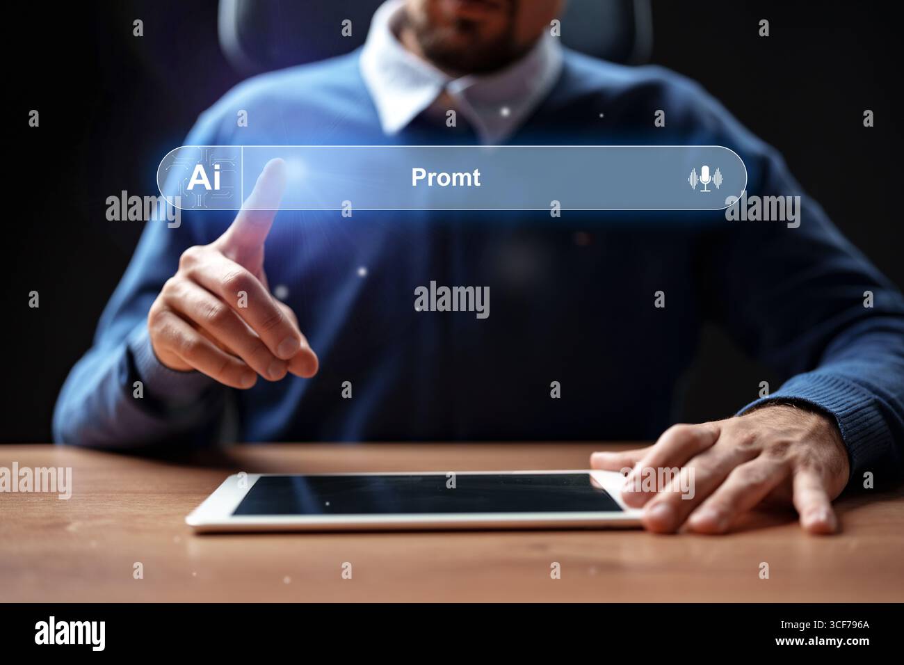 Man interacts with tablet using innovative technology during evening work session Stock Photo