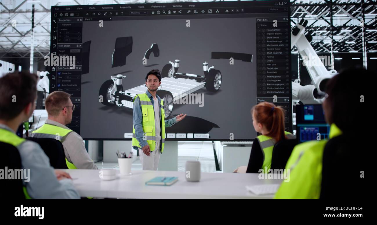 Multiracial Automotive Team Developing Electric Car Model With Professors Stock Photo