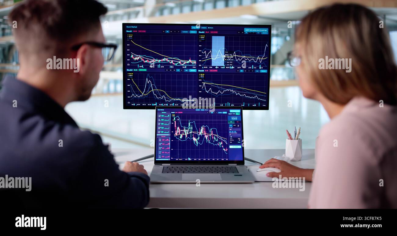 Financial Expert Analyzing Market Data For Online Trading On Computer. Stock Photo