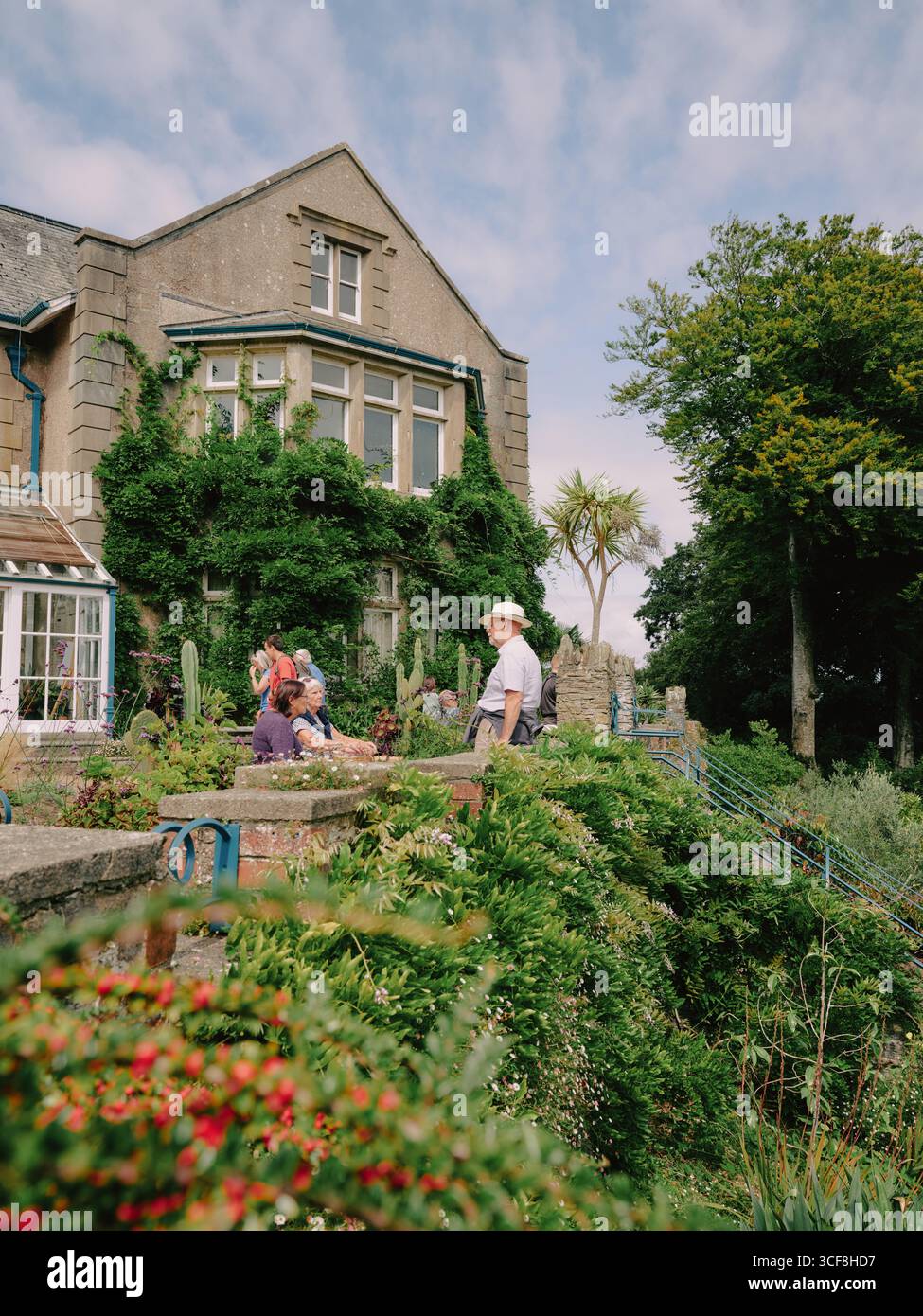 Tourists enjoying Overbeck's Garden at Sharpitor is an Edwardian subtropical Grade II registered garden at Sharpitor, Salcombe, Devon, England UK Stock Photo