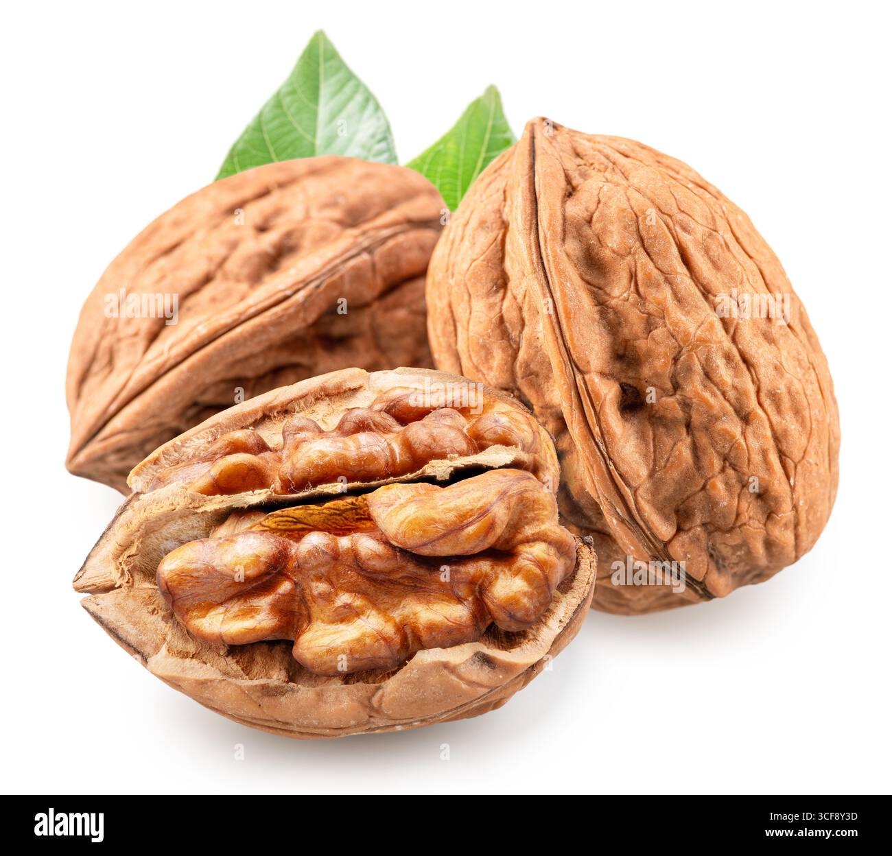 Whole walnuts and split walnut with kernel inside it isolated on white background. Clipping path. Stock Photo