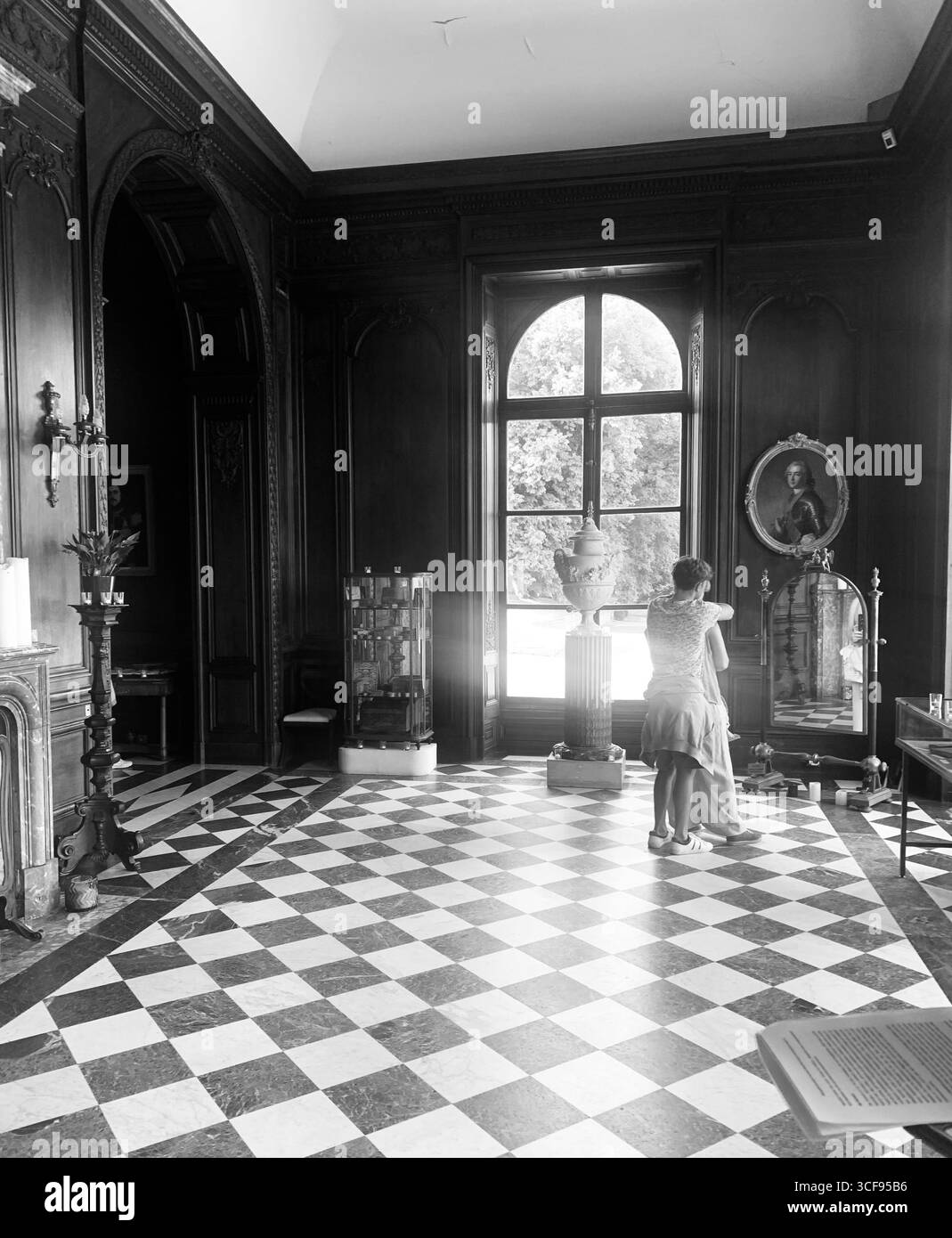 spooky french chateau ghost ghostly look black and white weird scary dancing ballroom window Halloween live lives country French France hall room - Smartphone Captured Stock Image