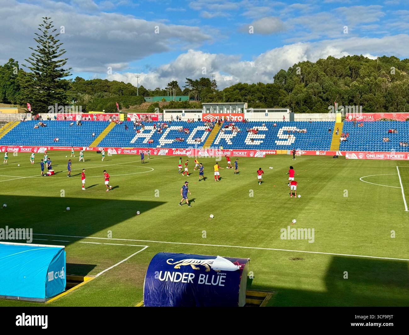 Match day atmosphere at Estádio de São Miguel, featuring players warming up ahead of the UEFA Europa Conference League play-off between CD Santa Clara - Smartphone Captured Stock Image