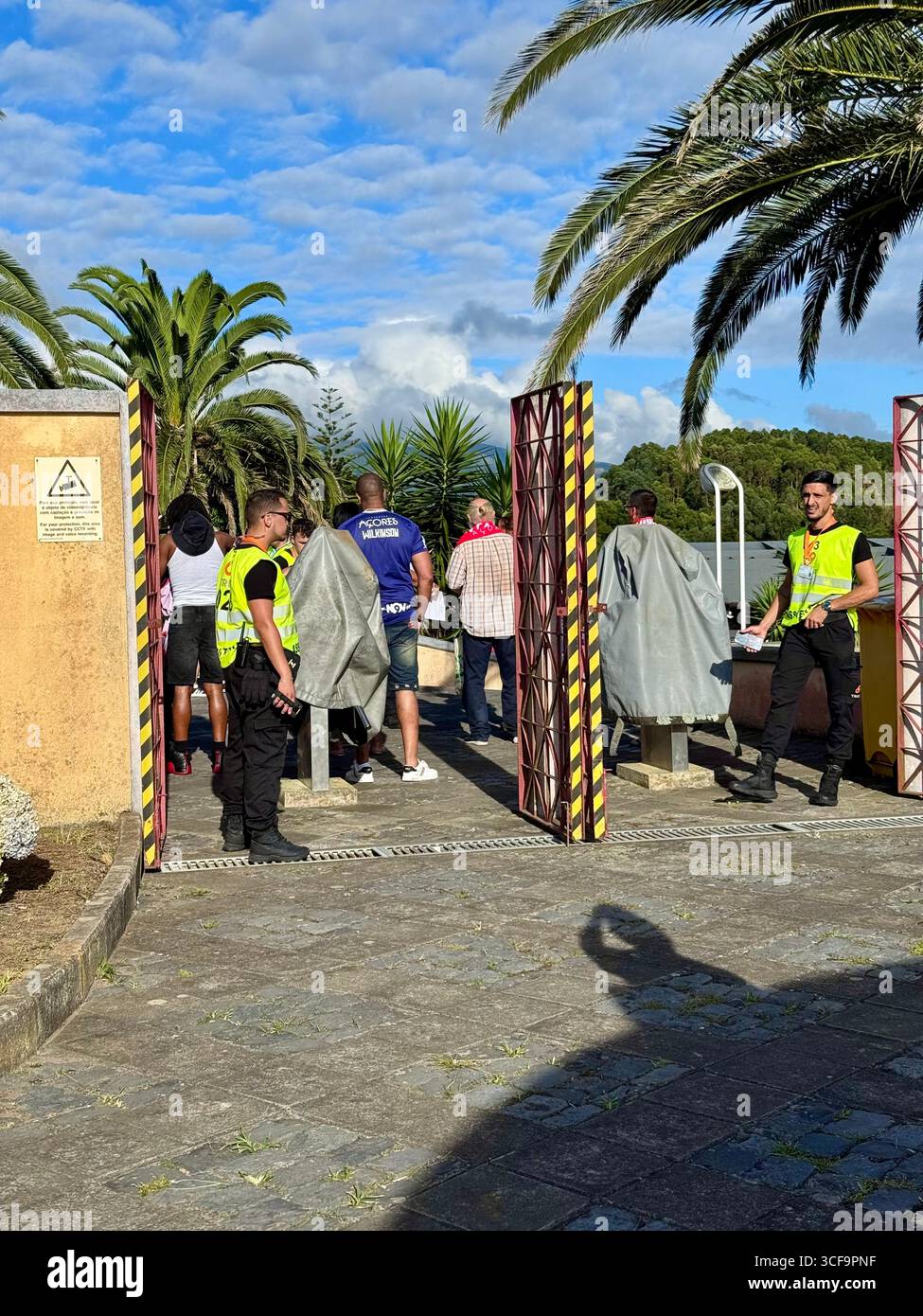 Football fans entering Estádio de São Miguel under security supervision for the UEFA Europa Conference League play-off between Santa Clara and Shamroc - Smartphone Captured Stock Image