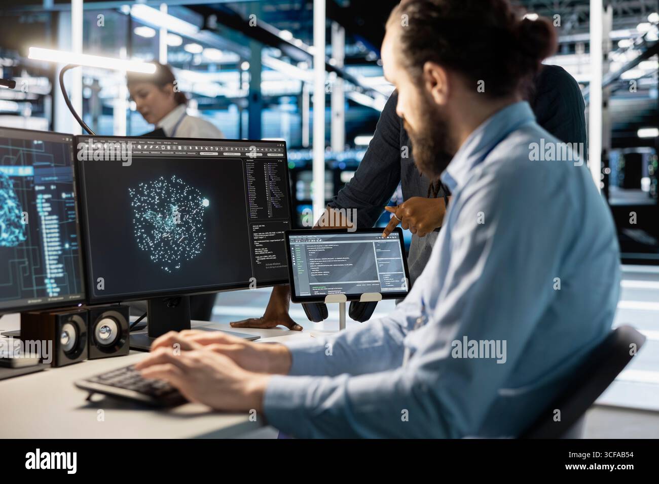 Technician using computer in data center, managing server virtualization, running scripts. IT expert using programming language on PC in server hub, finetuning network protocols Stock Photo