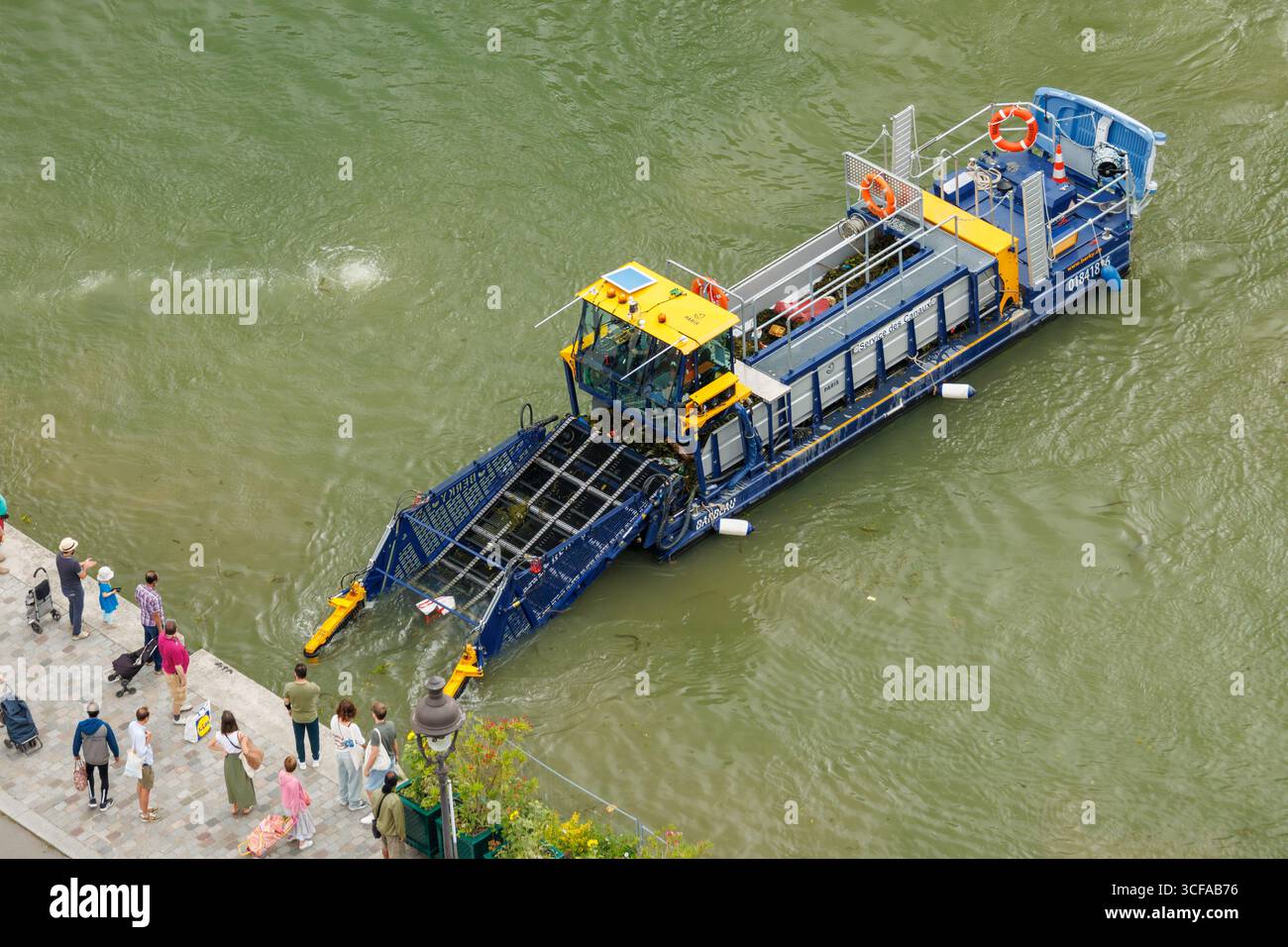 Aerial View Of A Clean up Boat On The Canal De L Ourcq In Paris Stock aerial-view-of-a-clean-up-boat-on-the-canal-de-l-ourcq-in-paris-stock